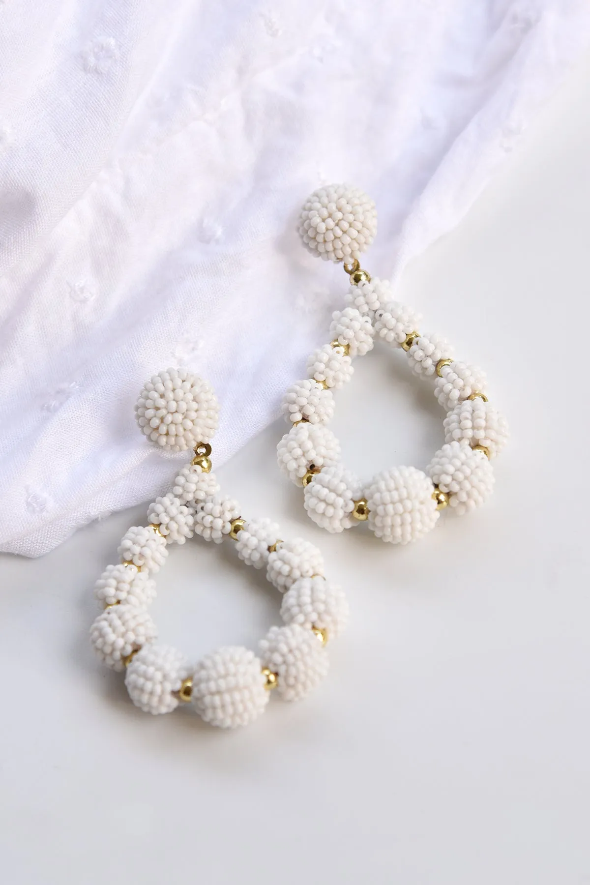 WHITE BEADED TEARDROP EARRINGS